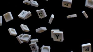 a jumble of scrabble letters flying in the air