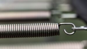 a coiled spring attached to what is probably a bed frame