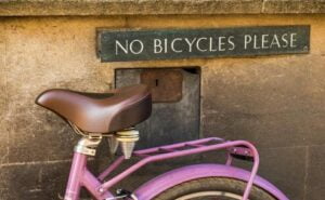 bicycle next to no cycles sign
